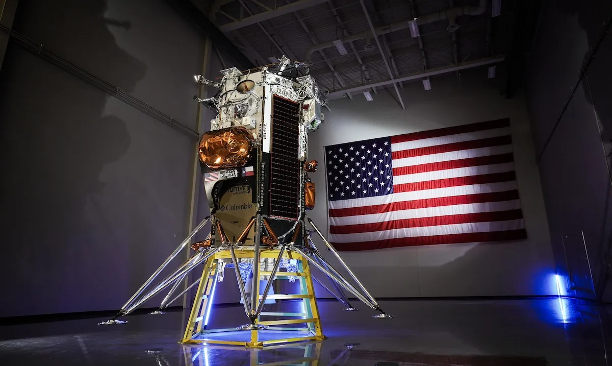 T-Minus: Countdown to the 10 best space stories of 2024 12 A spacecraft lander is displayed indoors with a large American flag on the wall behind it.