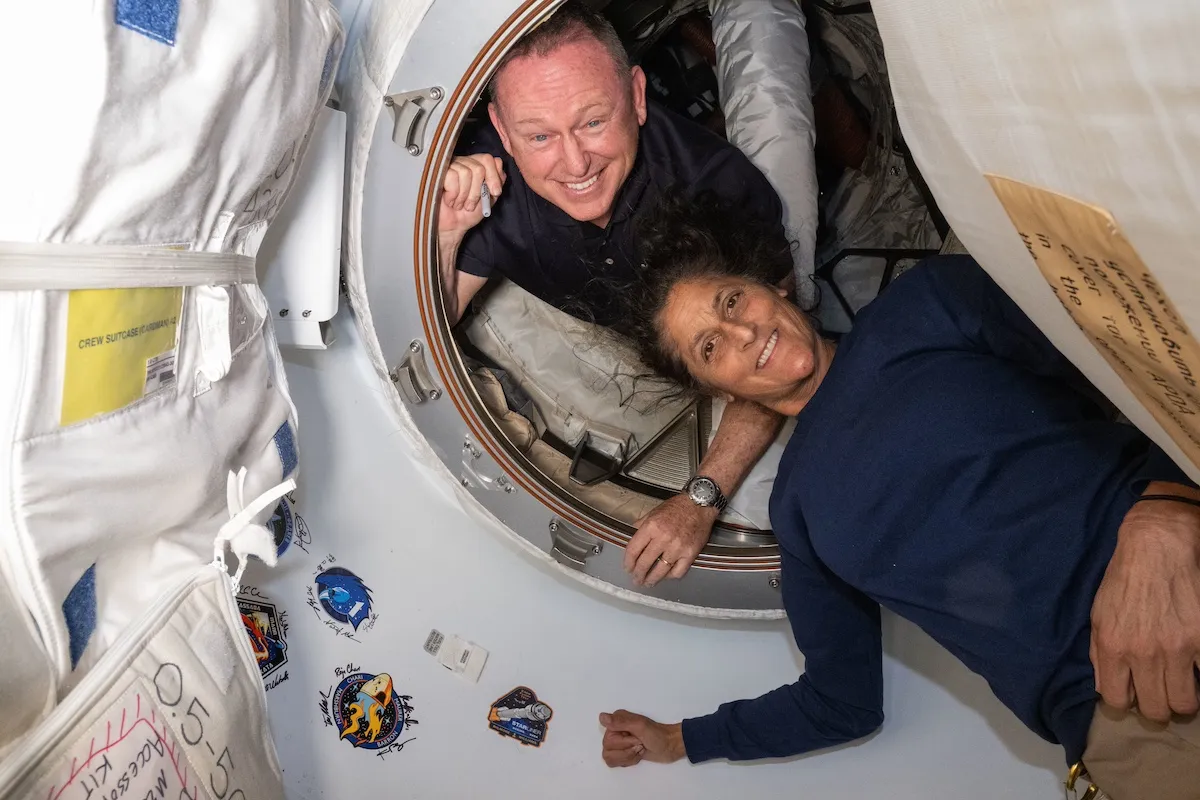 T-Minus: Countdown to the 10 best space stories of 2024 18 Two astronauts inside a spacecraft, one peeking through a hatch and the other floating, surrounded by mission spots.