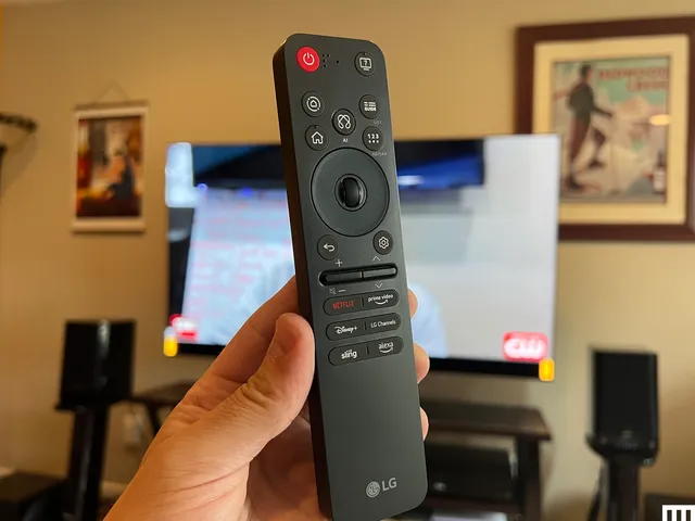 Image may contain: computers, electronics, devices, screen, remote control, TV and person