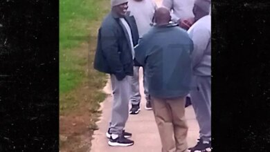 Diddy smiles and talks with fellow prisoners at Fort Dix